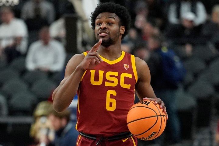 Southern California's Bronny James (6) brings the ball up the court during the first half of an NCAA college basketball game against Washington in the first round of the Pac-12 tournament Wednesday, March 13, 2024, in Las Vegas. 