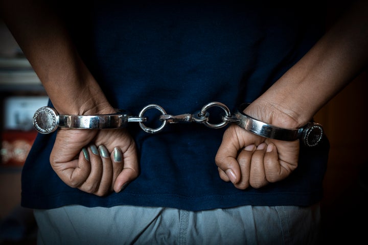 Close-up ff woman hand with Indian handcuffs