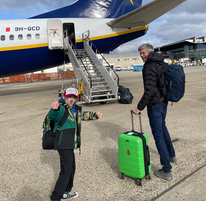 The author's husband and her son board a plane.