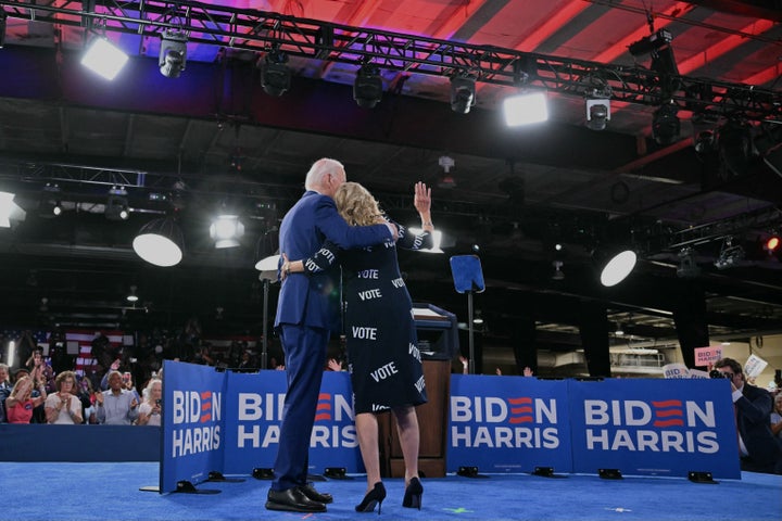 President Joe Biden and first lady Jill Biden walk off the stage Friday after a campaign event in Raleigh, North Carolina.