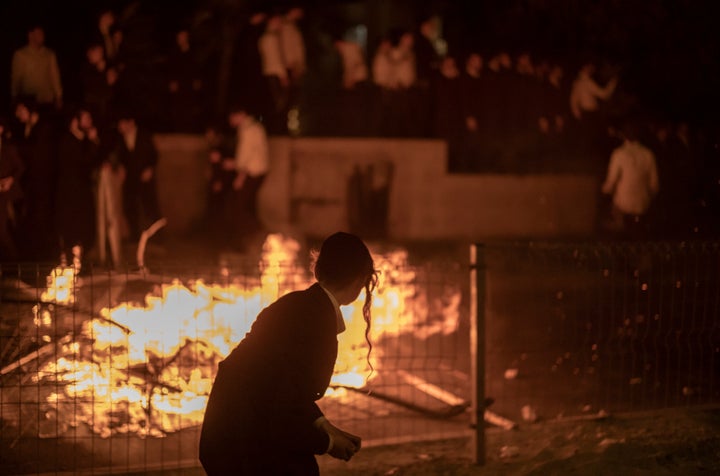 Israeli security forces scuffle with Ultra-Orthodox Jews protesting against the Supreme Court's recent landmark decision ordering them to enlist in the military, of which they were previously exempt, in Jerusalem, on June 30, 2024.