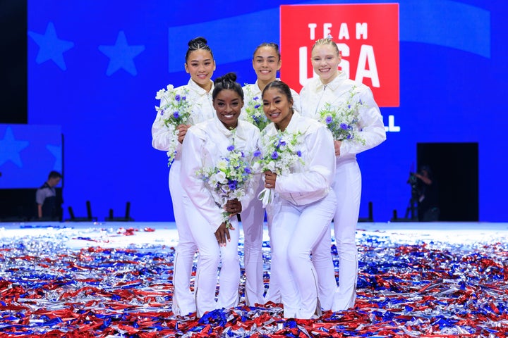 (Back to front, left to right) Suni Lee, Hezly Rivera, Jade Carey, Simone Biles, and Jordan Chiles celebrate after making Team USA for the Paris Olympics.