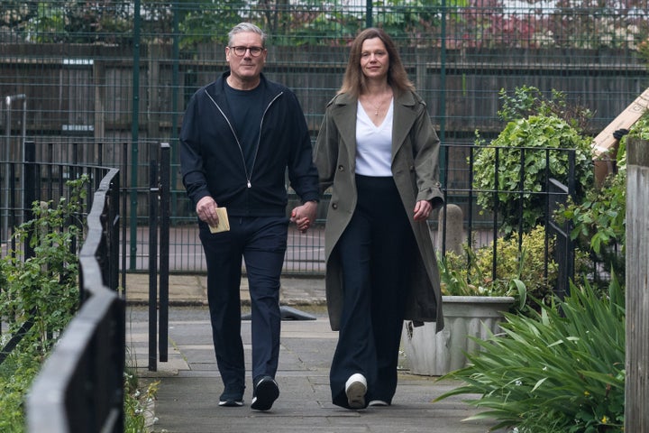 Labour leader Keir Starmer and his wife, Victoria, walk to a polling station to cast their votes in the local elections in London on May 2.