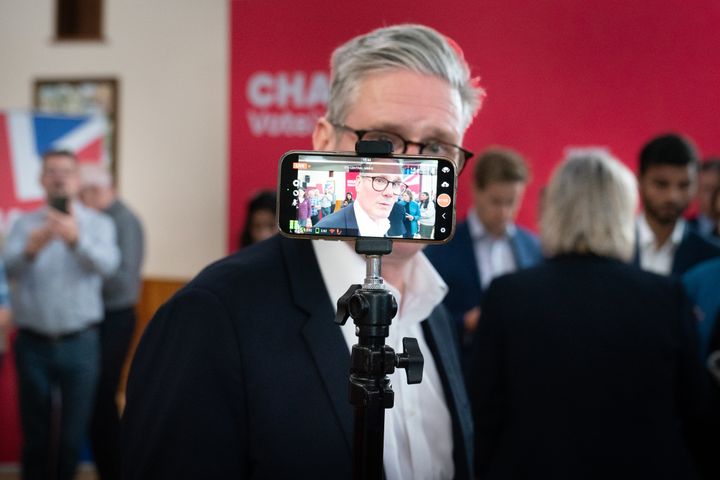 Keir Starmer takes part in a TV interview at a campaign event in Norton Canes in Staffordshire.