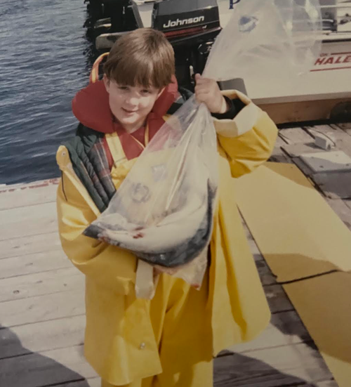 Randy is seen fishing as a child. "He always loved it," the author writes.
