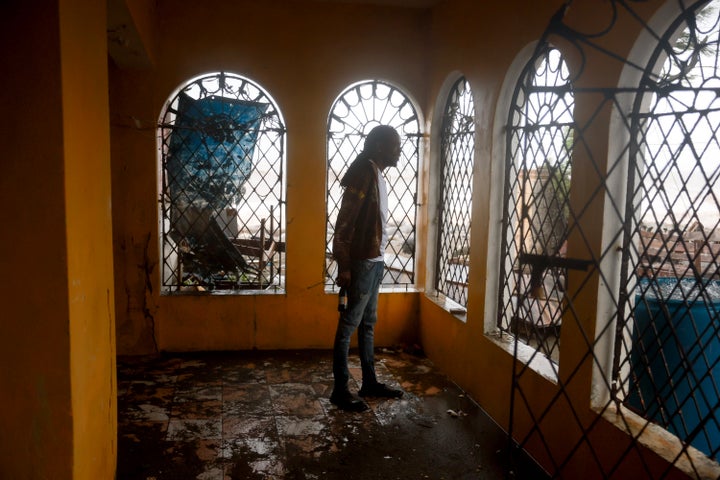 Marvin Williams stands on his muddy porch after ocean water reached his home as Hurricane Beryl passed through the area in Kingston, Jamaica, on July 3, 2024. Beryl has caused widespread damage in several island nations as it continues to cross the Caribbean.