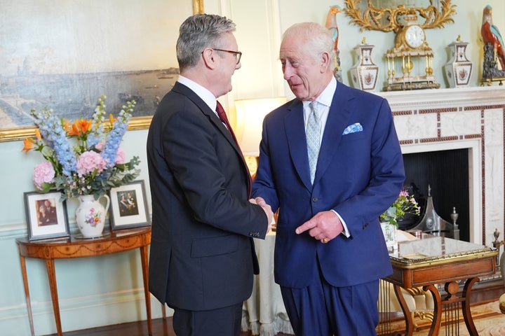 King Charles III welcomes Keir Starmer during an audience at Buckingham Palace, where he invited the leader of the Labour Party to become Prime Minister and form a new government.