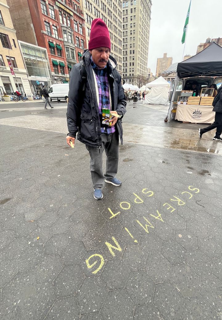 Felix Morelo drawing a Screaming Spot in Union Square Park in New York City.