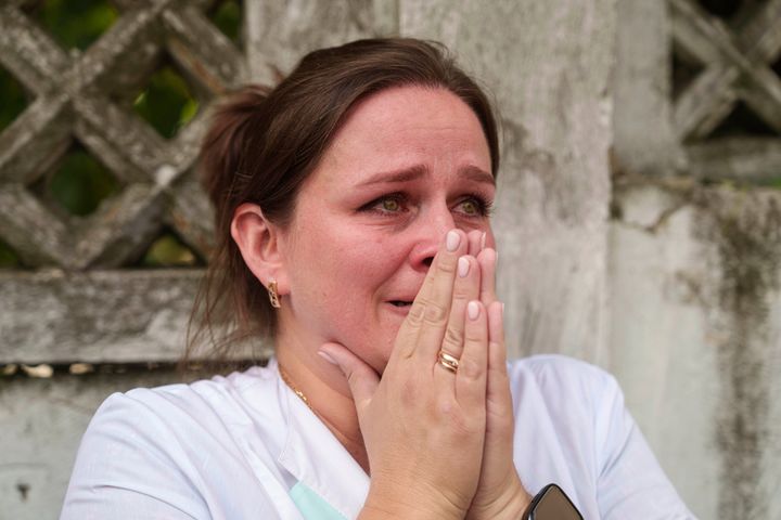 A woman reacts near the site of Okhmatdyt children’s hospital hit by Russian missiles, in Kyiv, Ukraine, on July 8, 2024. 