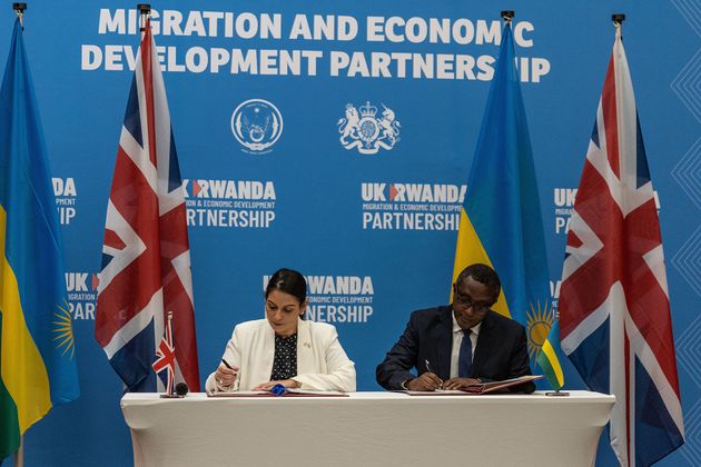 Priti Patel and Rwandan Minister of Foreign Affairs and International Cooperation Vincent Biruta sign the Rwanda partnership deal in April, 2022.