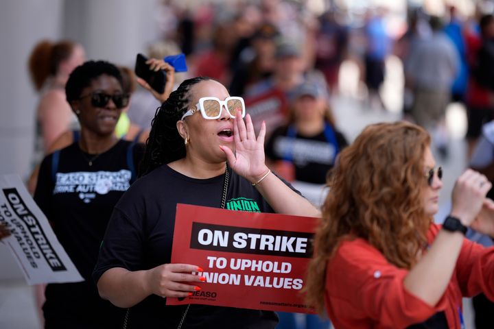 A demonstrator chants during a protest in support of the National Education Association Staff Organization outside the Pennsylvania Convention Center in Philadelphia on July 5.