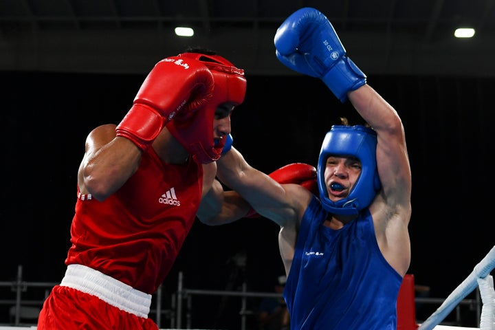 The Ukrainian Boxer Who Sacrificed His Olympic Goals -- And His Life -- Combating Russia 1 Ukraine's Maksym Halinichev, right, competing at the 2018 Youth Olympic Games in Argentina.