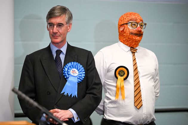 Jacob Rees-Mogg stands next to Barmy Brunch from The Official Monster Raving Loony Party during the declaration for the North East Somerset constituency last week.