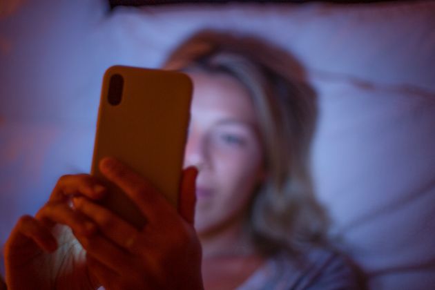 Here's what etiquette experts think about sending late-night texts. 