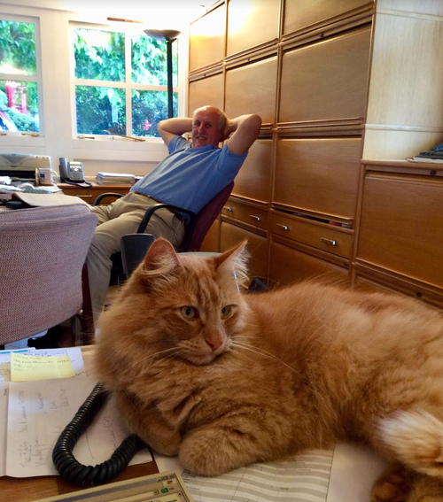 Simon relaxing in the home office with Softie, our cat, in 2015.