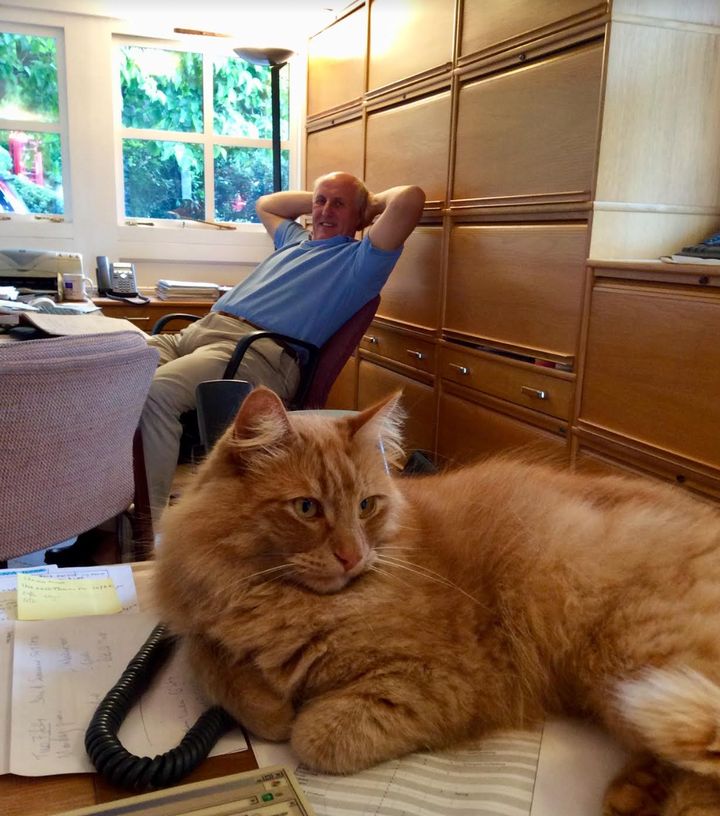 Simon relaxing in the home office with Softie, our cat, in 2015.