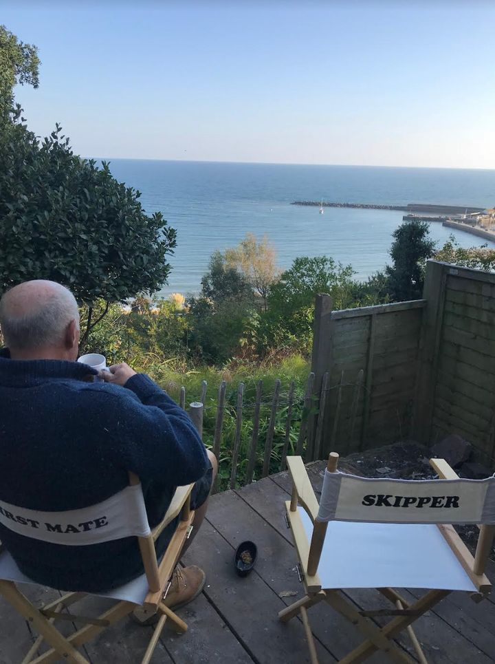 Simon having tea at the edge of our garden in 2018.