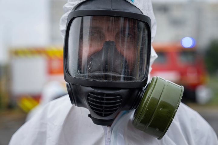 A Ukrainian emergency worker wearing a radiation protection suit attends training in Zaporizhzhia, Ukraine, on June 29, 2023. 