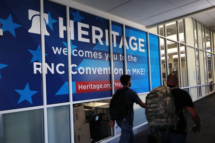 MILWAUKEE, WISCONSIN - JULY 12: People walk past a Heritage Foundation welcome sign for the Republican National Convention (RNC) at the Milwaukee Mitchell International Airport on July 12, 2024 in Milwaukee, Wisconsin. Republican presidential candidate, former U.S. President Donald Trump is expected to formally accept the GOP nomination for the 2024 U.S. presidential election during the convention. (Photo by Michael M. Santiago/Getty Images)