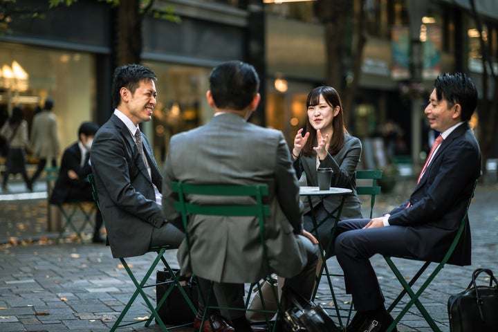 Businessmen meeting and working in a big city.