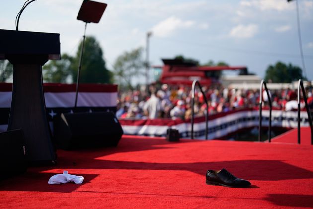 A shoe is left on stage after Trump was rushed away.