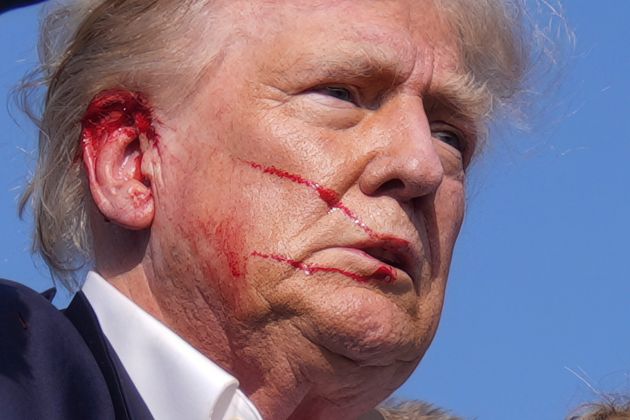 Trump is seen bloodied after a gunman attempted to assassinate him during his campaign rally in Butler.