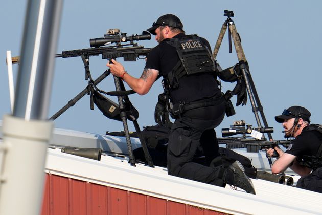 Police snipers return fire after the attempt on Trump's life.