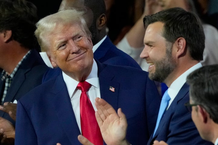 Republican presidential candidate former President Donald Trump, left, with Republican vice presidential candidate Sen. JD Vance (R-Ohio), right, on the first day of the Republican National Convention on July 15.