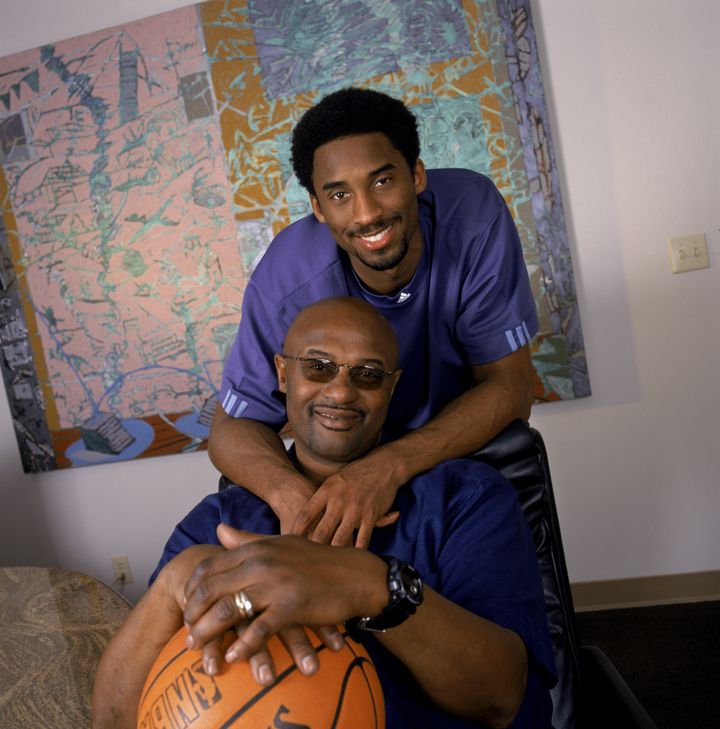 Kobe Bryant (top) poses for a portrait with his father Joe "Jellybean" Bryant in November 2000. It was announced Tuesday that Joe Bryant had died at age 69 after a serious stroke.