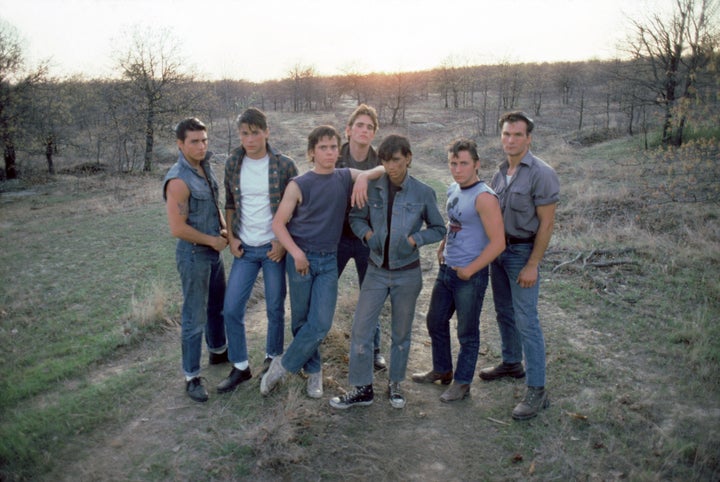 Actors Tom Cruise, Rob Lowe, C. Thomas Howell, Matt Dillon, Ralph Macchio, Emilio Estevez, and Patrick Swayze on the set of Francis Ford Coppola's "The Outsiders."