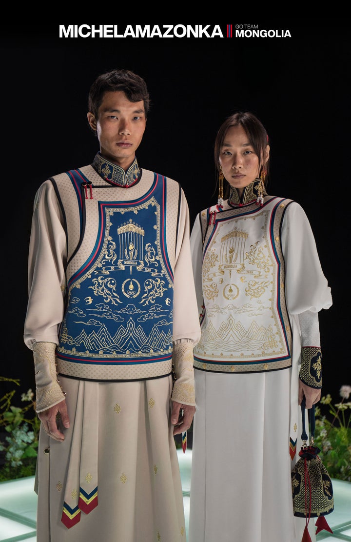 Models pose for a closer look at the details on Mongolia's uniforms.