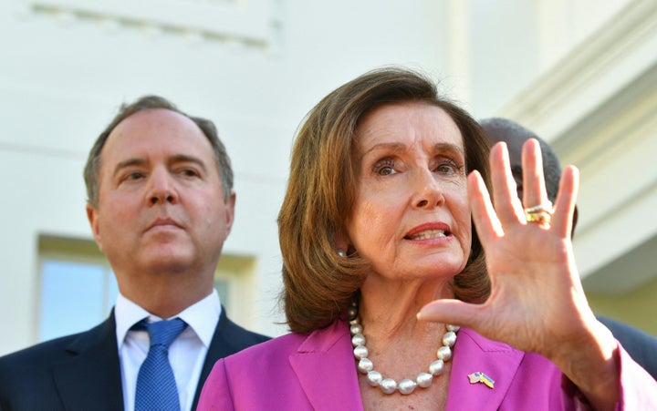 Rep. Adam Schiff (D-Calif.) listens as then-House Speaker Nancy Pelosi (D-Calif.) speaks to reporters following a meeting with President Joe Biden at the White House in Washington, D.C., on May 10, 2022. 