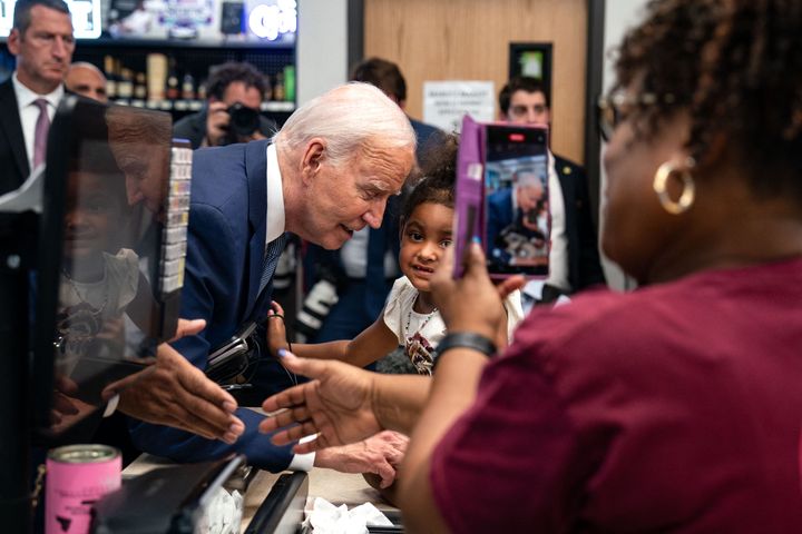 President Joe Biden greets a young girl during a visit to Mario's Westside Market grocery store in Las Vegas on Tuesday, July 16.