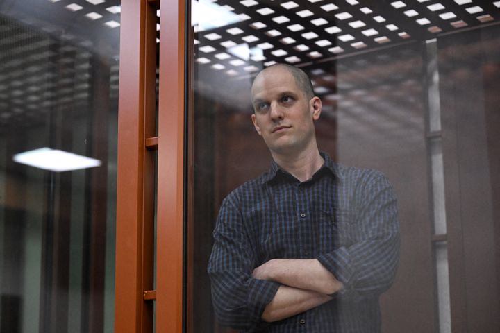 U.S. journalist Evan Gershkovich looks out from inside a glass defendants' cage prior to a hearing in Yekaterinburg's Sverdlovsk Regional Court on June 26, 2024. (Photo by NATALIA KOLESNIKOVA/AFP via Getty Images)