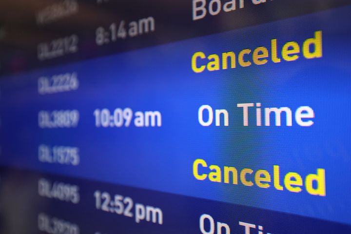 Flight boards show delayed or canceled flights at Minneapolis/St. Paul International airport after software issues delayed flights globally, Friday, July 19, 2024, in Minneapolis. (AP Photo/Adam Bettcher)