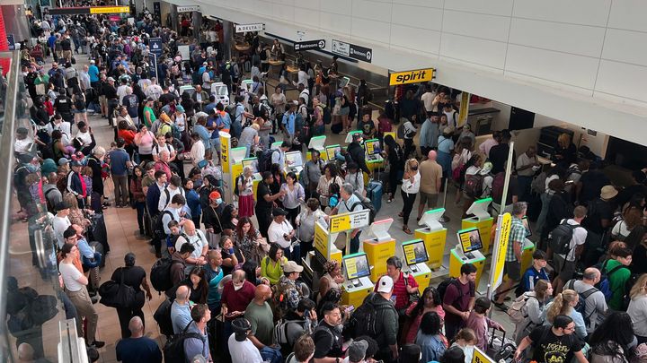 Crowds of stranded travelers wait at BWI Marshall Airport early Friday, July 19, 2024, after a worldwide technology outage impacted airlines, banks and other businesses. (Jerry Jackson/The Baltimore Sun/Tribune News Service via Getty Images)