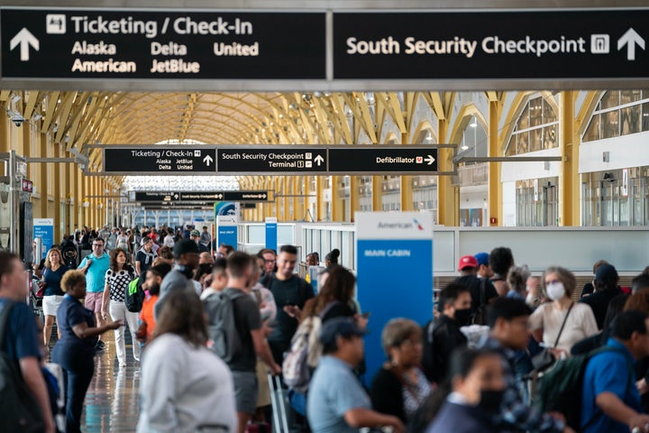 Travelers navigate customer service and ticketing lines at Ronald Regan Washington National Airport on July 19, 2024 in Washington, DC. (Photo by Nathan Howard/Getty Images)