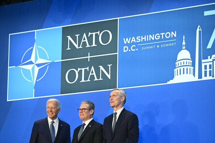 British Prime Minister Keir Starmer (center) is welcomed by Biden and NATO Secretary General Jens Stoltenberg for the NATO 75th anniversary summit in Washington, D.C., on July 10, 2024.