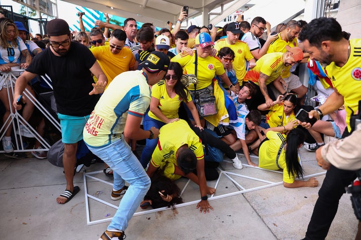 MIAMI GARDENS, FLORIDA - JULY 14: Fans of Colombia and Argentina try to pass the gate amid disturbances the CONMEBOL Copa America 2024 Final match between Argentina and Colombia at Hard Rock Stadium on July 14, 2024 in Miami Gardens, Florida. (Photo by Maddie Meyer/Getty Images)