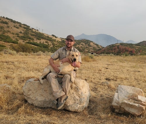 Conservation officer James Thomas is pictured with Kip, a search dog who was crucial to a woman's rescue in Utah.