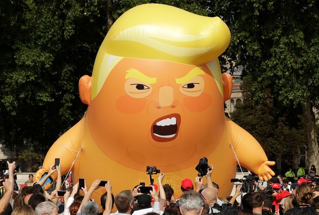A six-meter high cartoon baby blimp of then-US President Donald Trump is flown as a protest against his first visit, in Parliament Square in London, England in 2018.