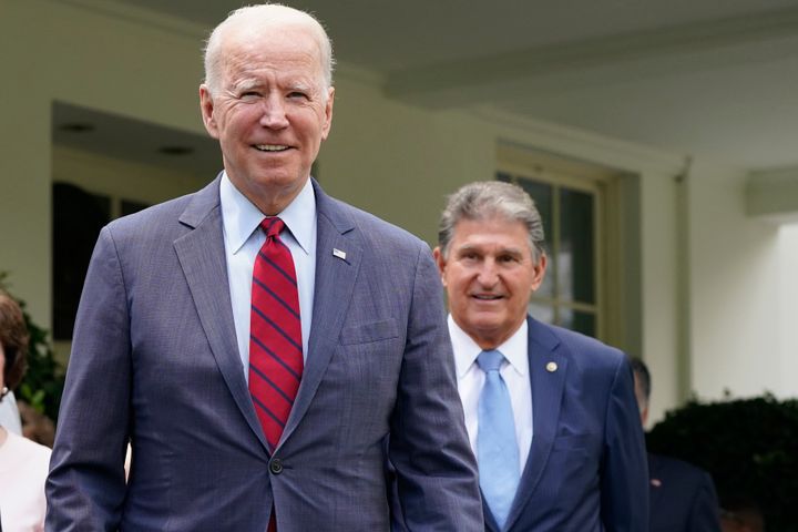 FILE - President Joe Biden, with Sen. Joe Manchin, D-W.Va., right, speaks outside the White House in Washington, June 24, 2021. Manchin, a Democrat turned independent, is urging Biden to drop his reelection bid and focus on the remaining months of his presidency. Manchin tells CNN Sunday, July 21, 2024, that he "came to the decision with a heavy heart that I think it's time to pass the torch to a new generation." (AP Photo/Jacquelyn Martin, File)