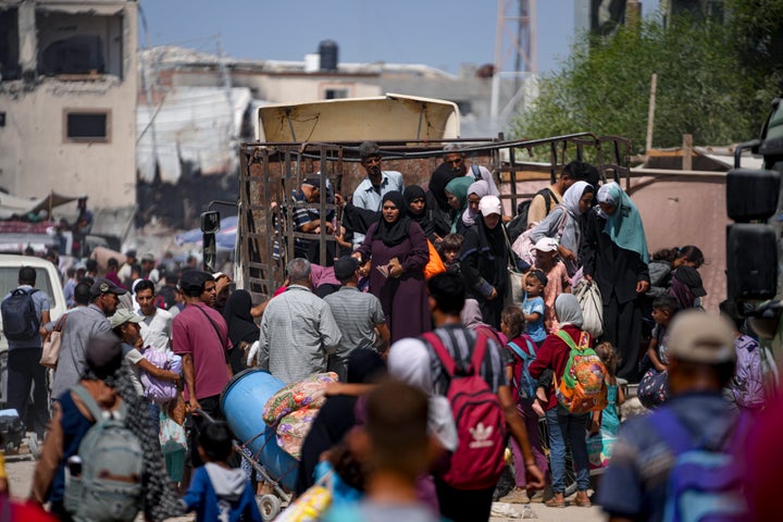 Palestinians displaced by the Israeli air and ground offensive on the Gaza Strip flee from parts of Khan Younis following an evacuation order by the Israeli army to leave the eastern part of Gaza Strip's second largest city, Monday, July 22, 2024. 