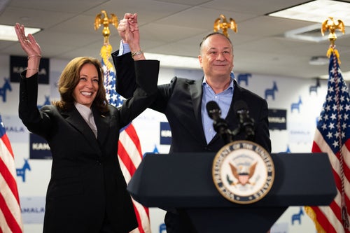 Vice Presdient Kamala Harris and Second Gentleman Doug Emhoff acknowledge the crowd before speaking at her campaign headquarters in Wilmington, Delaware, on July 22, 2024.