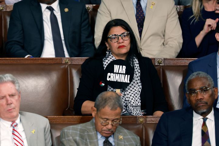 Rep. Rashida Tlaib holds a sign that reads "War Criminal" as Israeli Prime Minister Benjamin Netanyahu addresses a joint meeting of Congress on Wednesday in Washington, D.C. 