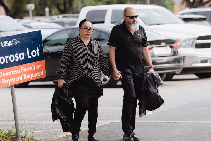 Janet Yamanaka Mello, left, an ex-civilian employee of the U.S. Army convicted of stealing $109 million from a youth development program for children of military families, and her husband, Mark Mello, walk into the federal courthouse Tuesday, July 23, 2024, in San Antonio, Texas.