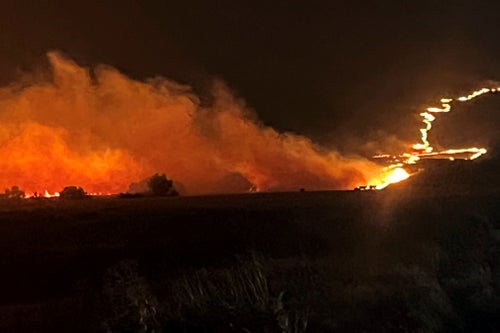 This photo provided by the Oregon Department of Transportation shows the Durkee Fire burning in eastern Ore., on July 22, 2024.