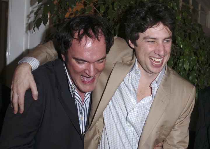 Quentin Tarantino and Zach Braff embrace at an award ceremony in 2005.