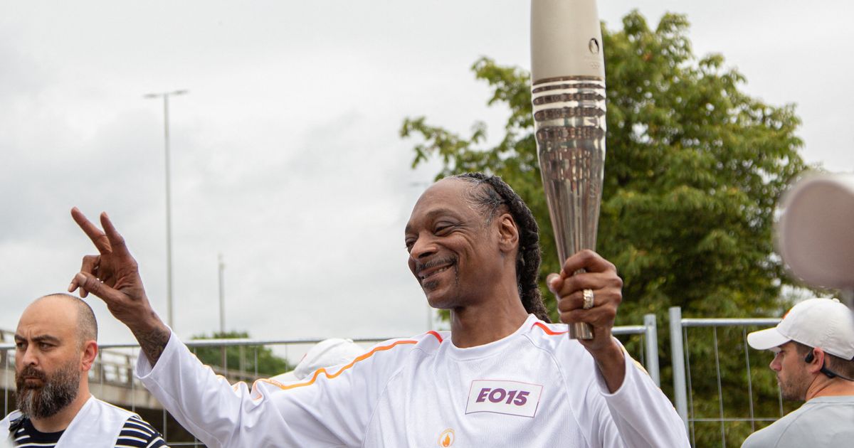 Snoop Dogg Carries Olympic Torch In Paris