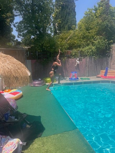 The author at the swimming pool for the first time with two friends in July 2024.